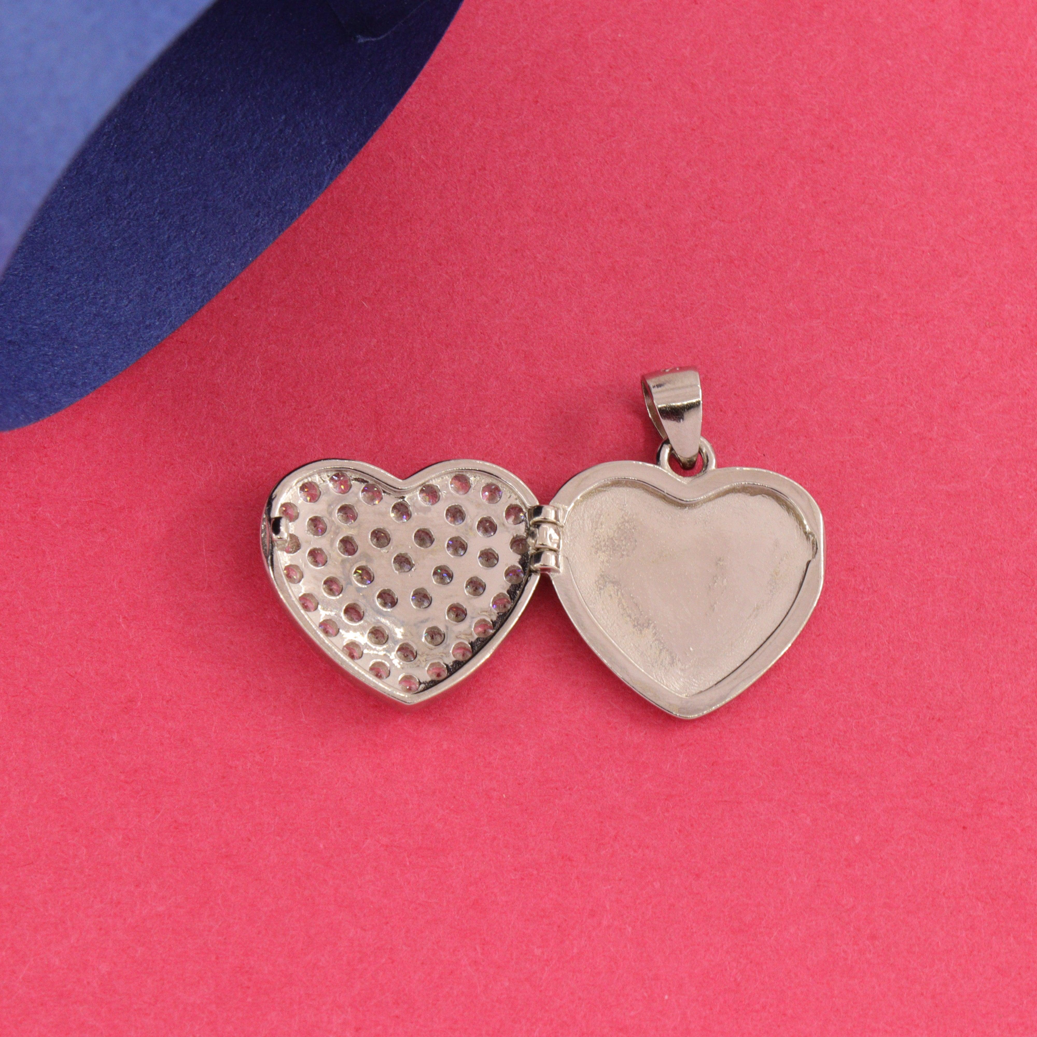 925 silver heart-shaped women's pendant with open locket on pink background