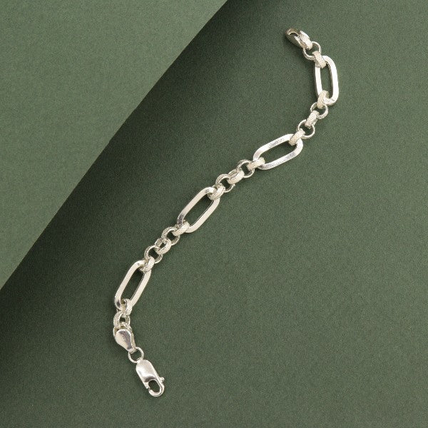 925 silver Sumit kids bracelet KB-184, 6g, 16.5cms in length, featuring a classic link design and lobster clasp against a green background