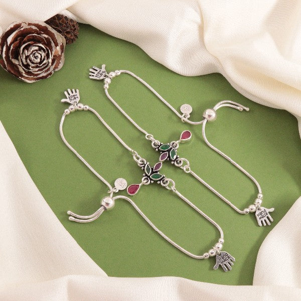 925 Silver Eshita Women Anklets ANK-155 featuring intricate design with adjustable size, showcasing beautiful details against a green backdrop.