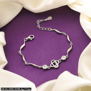 925 Silver Shree Kids Bracelet KB-69, 17cm, 5g with purity 925 on a purple background with white fabric drapes.