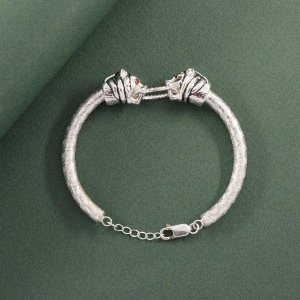 925 silver adjustable tiger kids bracelet KB-180 with clasp on green background.
