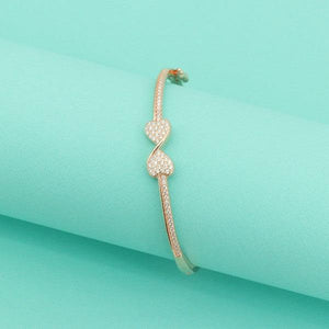 Elegant 925 silver bangle for women with heart design and intricate detailing on a turquoise background. Weight 12g, Purity 925.