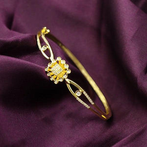 Elegant 925 silver Akhila women kada WKD-160 with intricate design and gold finish, weight 10g, bangle size 2.6, purity 925, on purple fabric