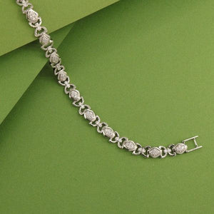 925 silver Nikhilesh men bracelet MB-149 with intricate design, 22.5cm length, showing 18g weight and 925 purity on a green background.