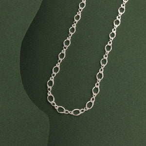 925 Silver Sutejas Men Chain MC-174, 17g, 50cms length showcasing intricate link design against dark green background
