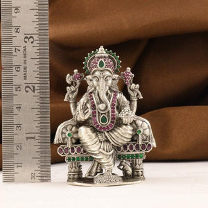 925 silver 3D Ganesha idol with intricate designs, weighs 112g, 7cm tall, purity 925 silver, next to a ruler for scale.