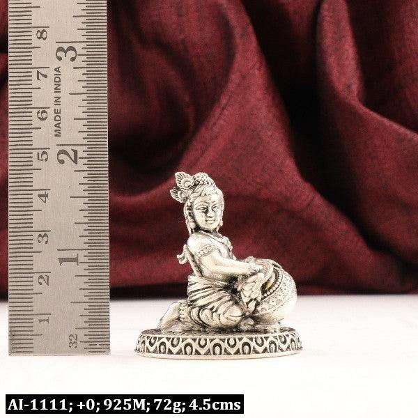 925 silver 3D Venna Krishna idol, 72g, 4.5cm with red background and ruler for size reference