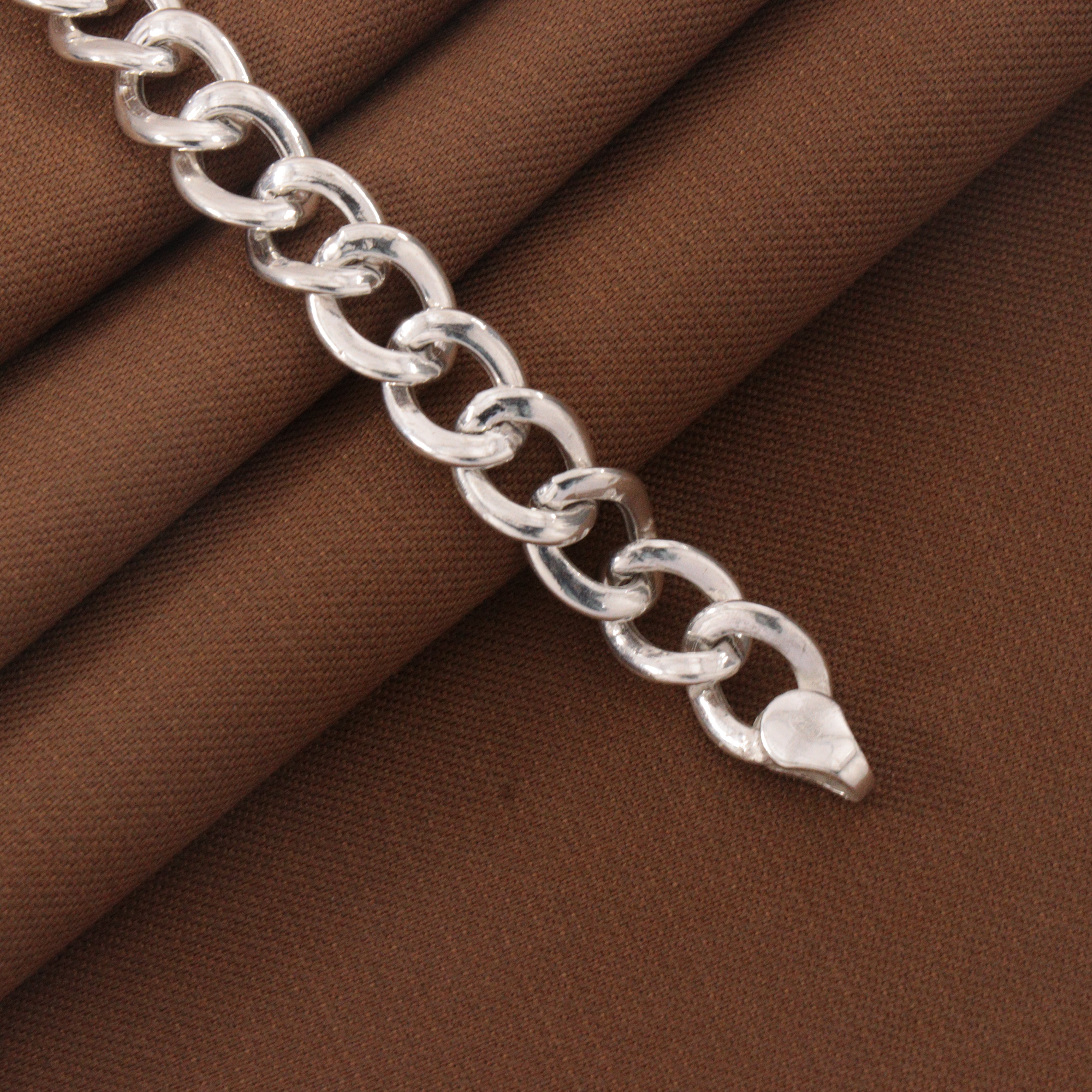 925 silver kids bracelet KB-195 with chain design, 14cm long, displayed on brown fabric.