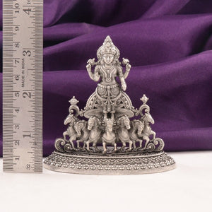 925 Silver 2D Suryanarayana idol, 80g, 8.5cm, crafted with 925 purity silver, featuring detailed chariot design on purple fabric backdrop.