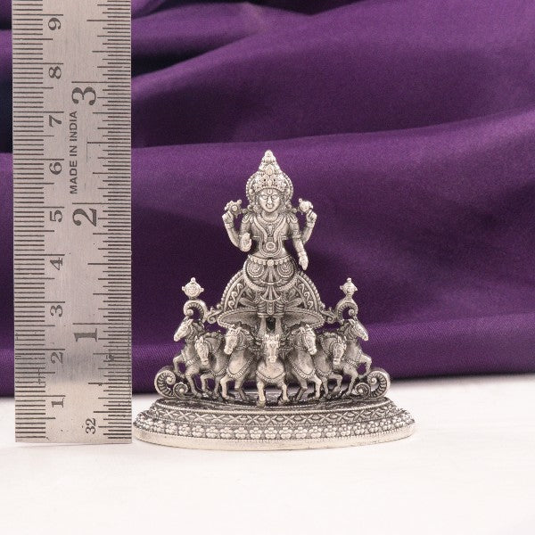 925 silver Suryanarayana idol weighing 35g and measuring 6cms, showcasing intricate design and craftsmanship against a purple background.