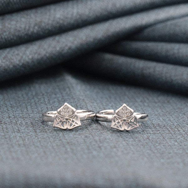 925 Silver Anurati Women Toe-Rings TE-286 on soft fabric background, featuring intricate design and purity stamp.