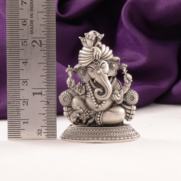 925 silver Ganesha idol weighing 34g with dimensions of 5.5cms, showcased next to a ruler for scale measurement.