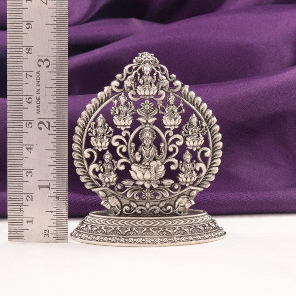 925 Silver Ashtalakshmi Idol, 69g, 7.5cm, with intricate details, showcased on purple fabric with a ruler for size reference.