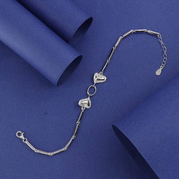 925 Silver Ushma Women Bracelet LBR-357 with heart charms, 21cm length, 7g weight, and purity 925 on blue background.