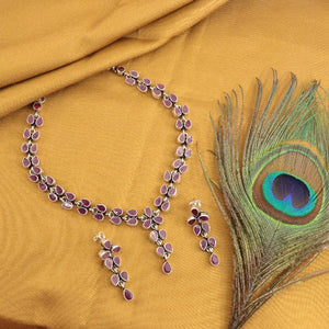 "925 Silver Saparna Women Necklace NK-200 with purple stones and matching earrings on mustard fabric with peacock feather"