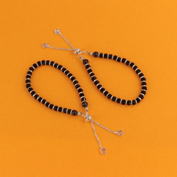 925 Silver Siddheshwari Kids Kada KKD-77 with adjustable length showcasing black beads on an orange background. Ideal for children, weight 7g.