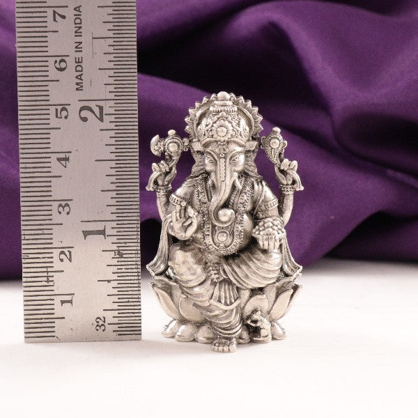 925 silver 3D Ganesha idol weighing 52g and measuring 5.5cm in height, positioned next to a ruler for scale.