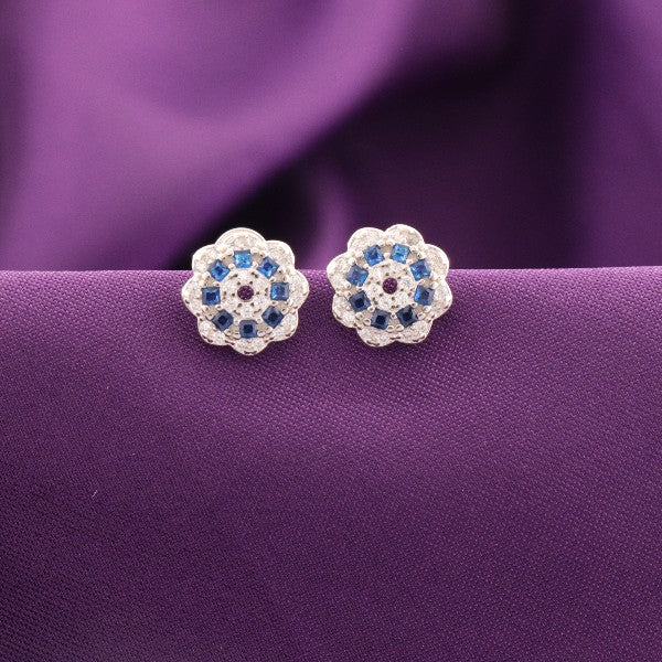 925 silver Amiya women's studs STD-292 with blue stones on purple fabric background