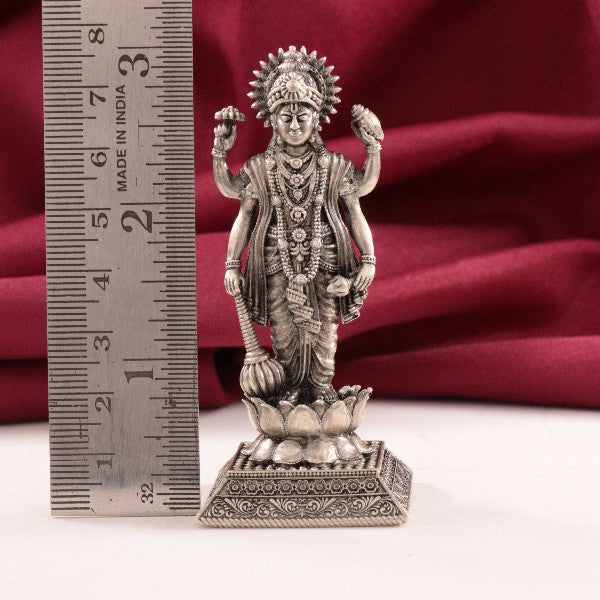 925 silver 3D Satyanarayana Swamy idol, 61g, 7.5cm, with a ruler for size reference and red background