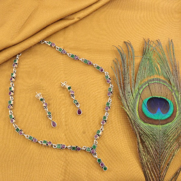 925 silver mandra women necklace NK-204 with matching earrings and peacock feather on mustard fabric background