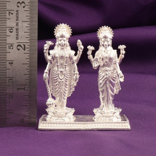 925 silver 3D Lakshmi Narayana idols weighing 106g and measuring 6.5cms in height displayed on a purple background with a ruler for scale.