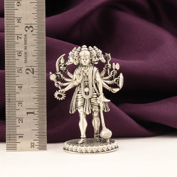 925 silver Panch Mukhi Hanuman idol weighing 66g and measuring 6.5cms in front of a ruler against a purple background