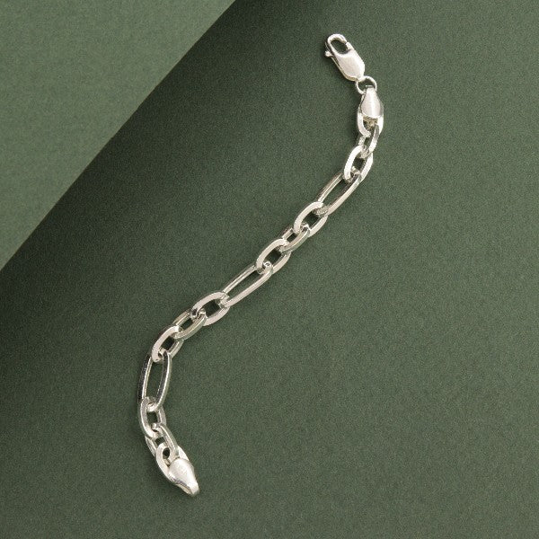 925 Silver Bhavesh Kids Bracelet KB-186 on green background showing chain design and lobster clasp, 13cm in length, weighing 5g