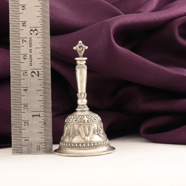 925 silver 3D bell Shanku Chakra idol weighing 42g and measuring 7cm in length next to a ruler for scale