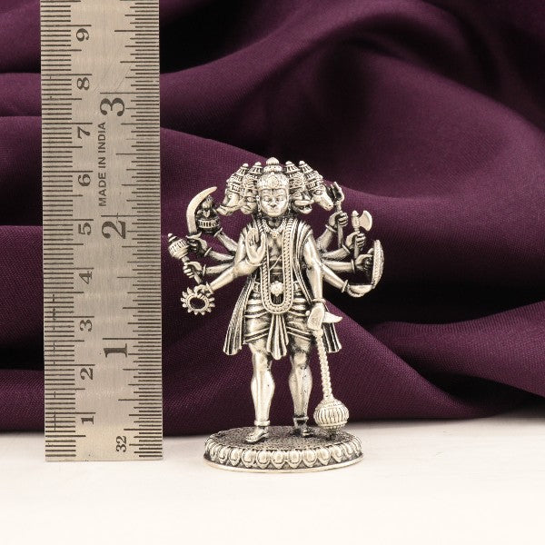 925 silver 3D Panch Mukhi Hanuman idol, weight 65g, dimension 6.5cms, placed next to measuring ruler on purple background.