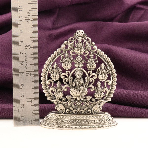 925 silver 2D Ashtalakshmi idol, 94g, 9cm height, with detailed carvings, placed beside a ruler for scale.