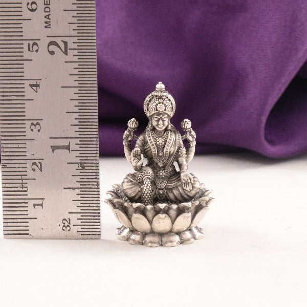 925 silver 3D Mahalakshmi idol weighing 28g and measuring 4cms in length, showcasing intricate design details with a ruler for scale.