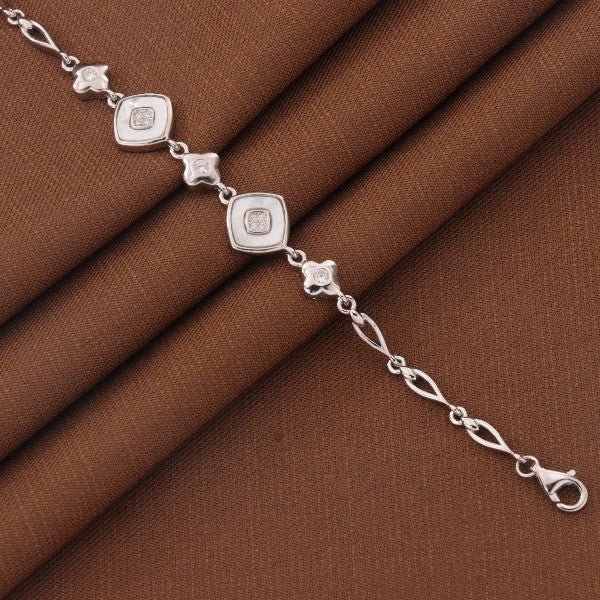 925 silver Jyotirmoyee kids bracelet KB-232, 18cm in length, showcasing intricate design on brown fabric background.