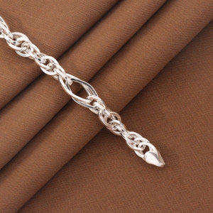 925 silver kids bracelet KB-203 with intricate design displayed on brown fabric, 15cm length, 6g weight, purity 925.