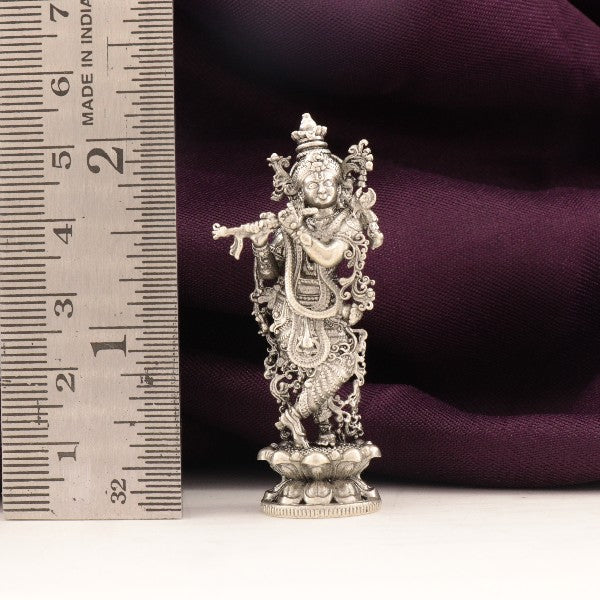 925 silver 3D Krishna idol weighing 25g, 5.5cm tall, detailed craftsmanship, adjacent to a ruler for size reference.