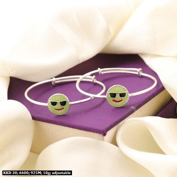 925 silver Asvika Kids Kada KKD-30, 10g adjustable bracelets with smiley face design, purity 925, on purple box with white fabric.