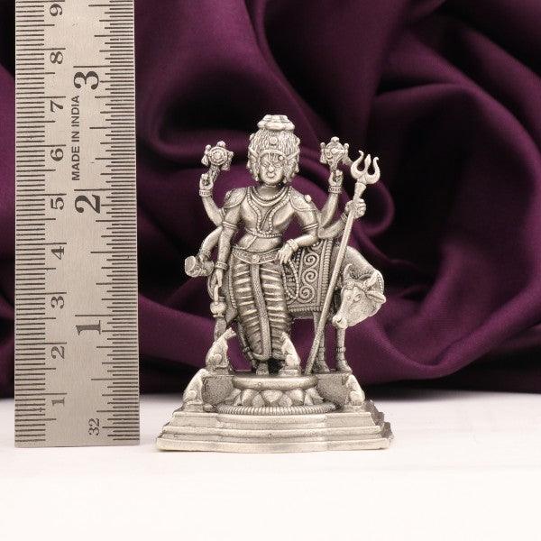 925 silver 2D Dattatreya idol, 60g, length 6.5 cms, purity 925, next to ruler for scale, with purple cloth background.