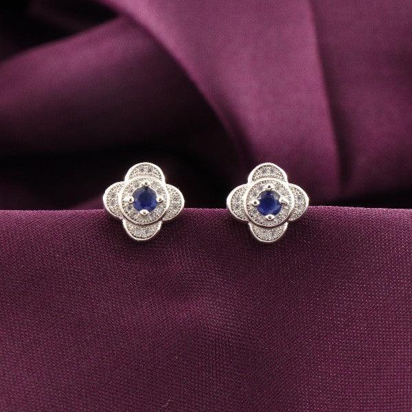 925 silver Ura women studs STD-263 with gemstone center, 3g, purity 925, displayed on a purple cloth background.