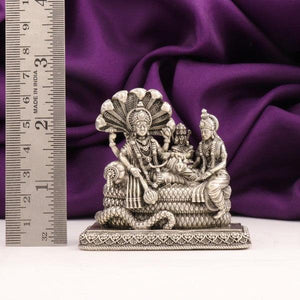 925 silver 3D Mahavishnu Lakshmi Devi idol, weight 134g, dimensions 6.5cms, next to a ruler for scale, shown against a purple fabric background