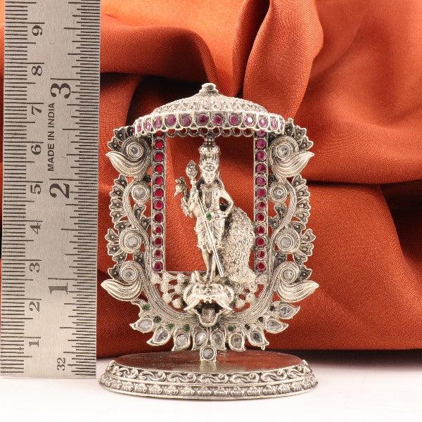 925 silver Murugan idol, 58g, 7.5cm, intricate design with ruler scale for reference against orange fabric background