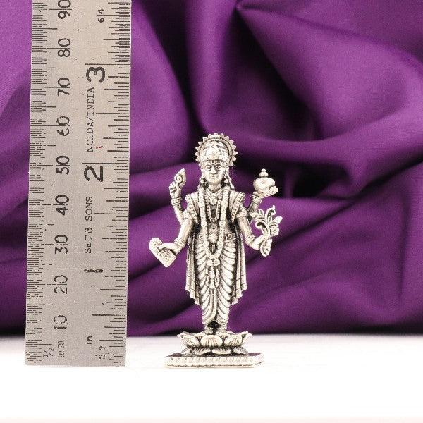 925 Silver 3D Dhanvanthri Idol, 39g, 6cm, Purity 925, shown with purple fabric and ruler for scale.