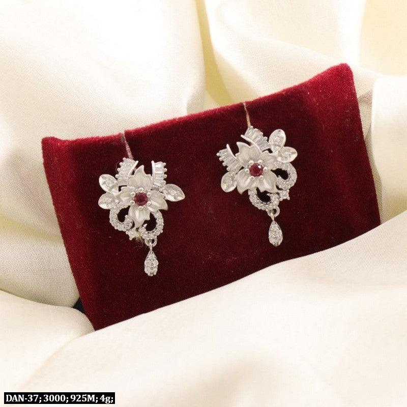 Elegant 925 Silver Naveena Women Danglers DAN-37 with floral design, 4g weight, showcased on a red velvet background