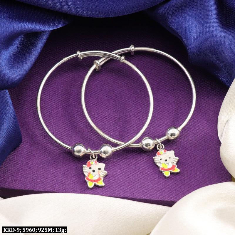 925 silver Hello Kitty kids kada KKD-9, 13g weight, purity 925, two silver bangles with Hello Kitty charms on purple fabric background