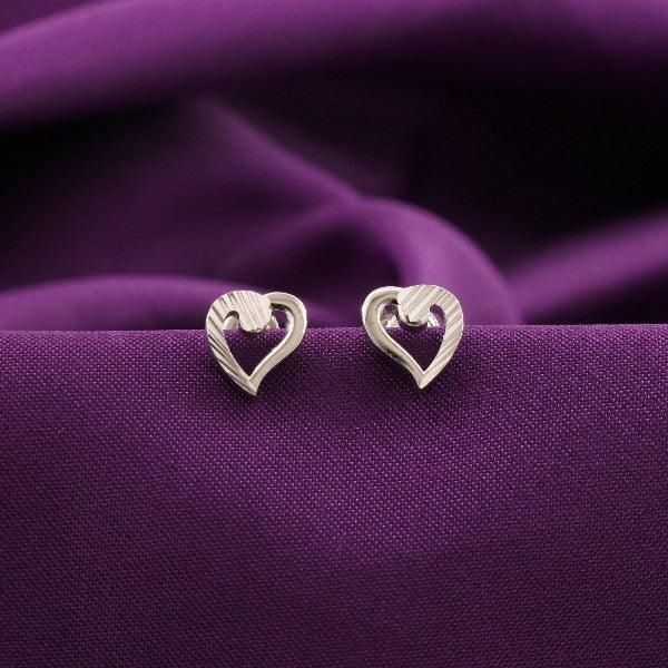 925 silver Manju kids studs KS-156 weighing 3g, heart-shaped design, against a purple fabric background.