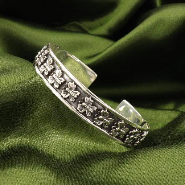 925 silver butterfly men kada MKD-68 with intricate floral design, 20g openable bracelet on green fabric background