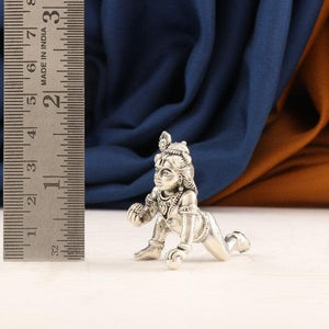 925 silver 3D Laddu Krishna idol weighing 42g and measuring 4cms next to a ruler