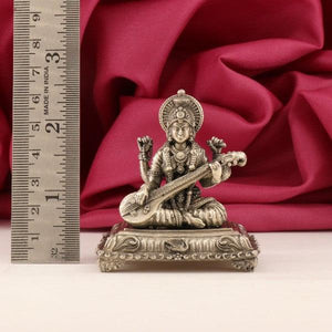 925 silver 3D Saraswathi idol, 85g, 6.5cm tall, shown with a ruler for scale, set against a red background