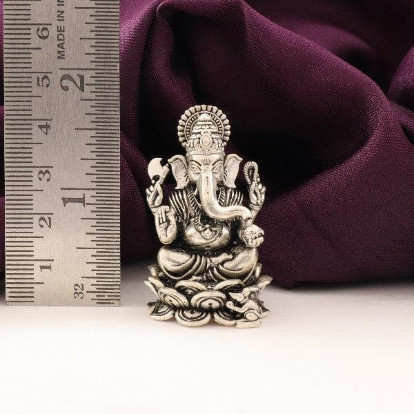 925 silver 3D Ganesha idol weighing 60g and measuring 4cms in length with a scale for size reference in the background.