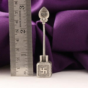 925 silver 3D Vel idol weighing 18g and 7.5cms long, shown next to a ruler for measurement, with a purple cloth background.