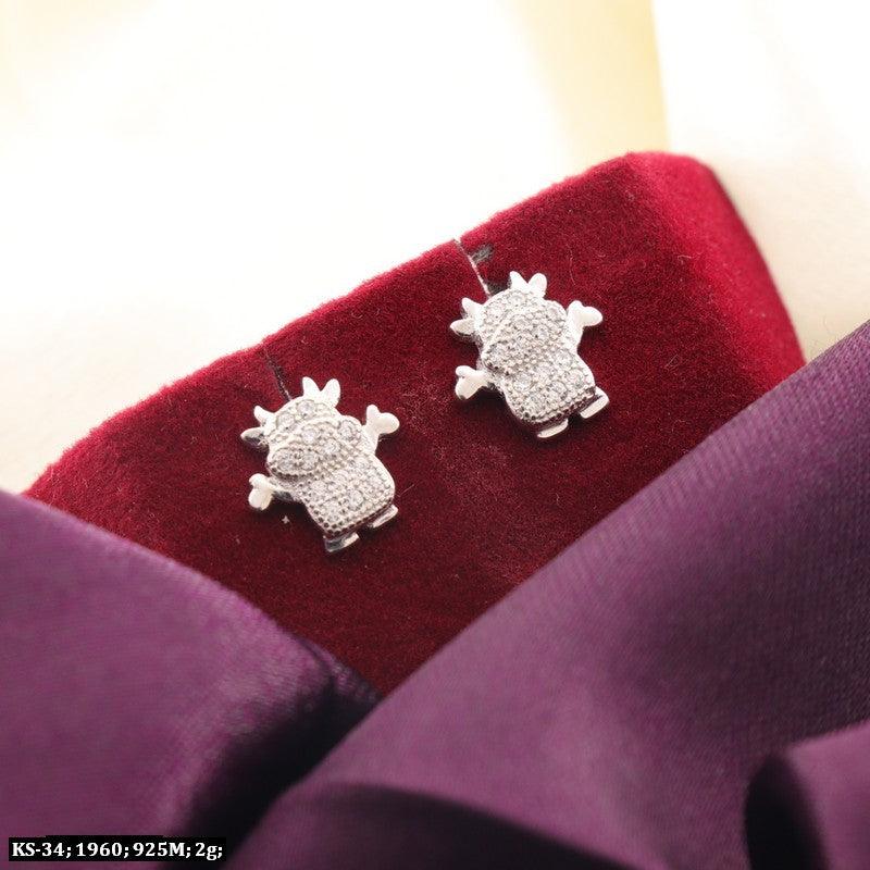 925 silver studded cow kids earrings KS-34, 2g weight, showcasing a cute design against a red and purple background.