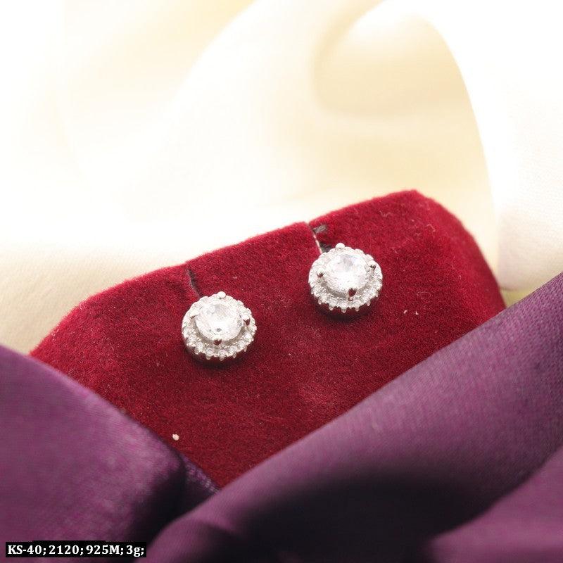 925 silver Pushpa kids studs KS-40, 3g on red velvet with purple and cream fabric background. High purity children's earrings.